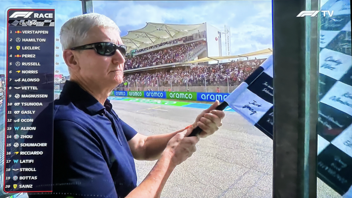 Tim Cook (kindly) waves the US F1 GP flag